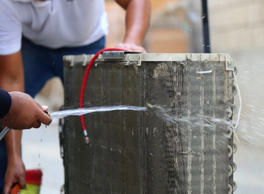 Cleaning ac coil using water